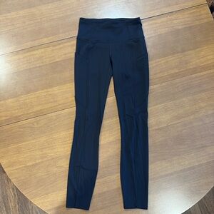 Lululemon size 2 black leggings.  Side pockets.  Hidden pocket in waistband.